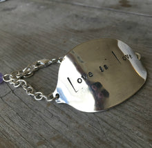 Stamped Spoon Bracelet Love is Love closeup of hand stamping of letters