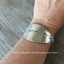 Stamped Spoon Bracelet Love is Love shown on models arm