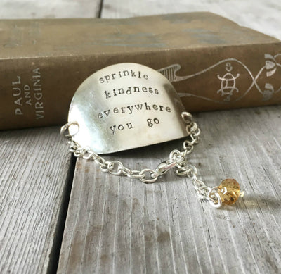 Sprinkle Kindness Everywhere You Stamped onto an upcycled spoon bracelet
