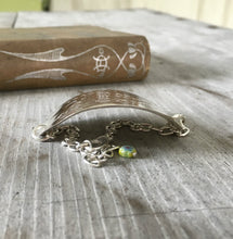 Side view of curve of stamped spoon bracelet about teaching