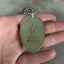 I DON'T WANT TO ADULT TODAY hand-stamped spoon necklace held in hand for scale showing vintage silverplate patina