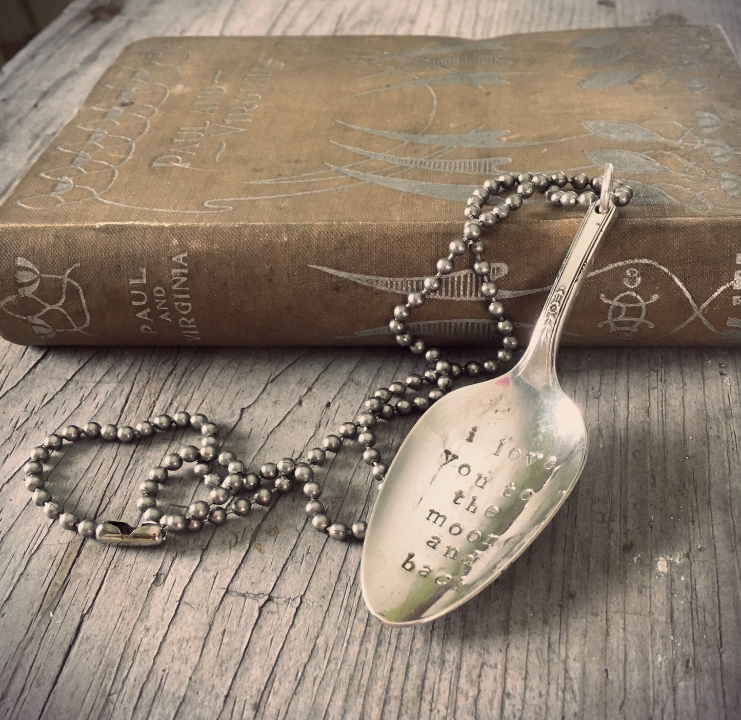 Stamped spoon necklace in convex shape