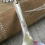 Neck of handstamped silverplate spoon necklace I love you to the moon and back