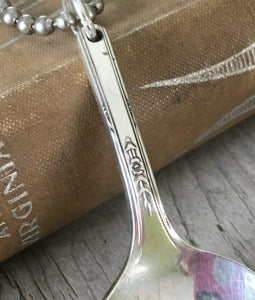 Neck of handstamped silverplate spoon necklace I love you to the moon and back