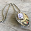 Side view of LOVE spoon necklace showing vintage silverware bowl and pewter photo frame detail, one-of-a-kind handcrafted design
