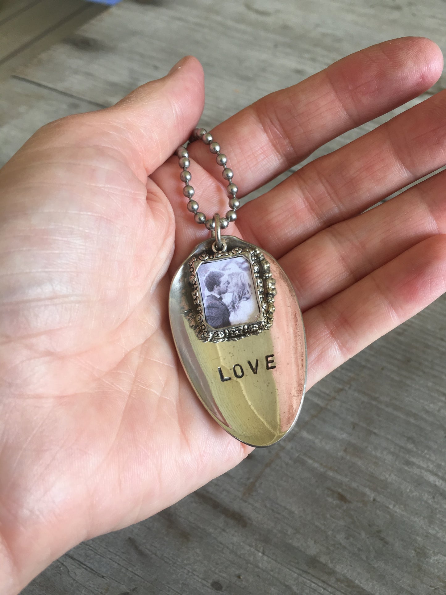 LOVE stamped spoon necklace with pewter photo frame held in hand for scale on vintage ball chain, Valentine's Day gift