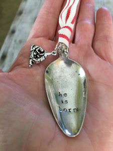 Stamped Spoon Christmas Ornament shown in hand for scale