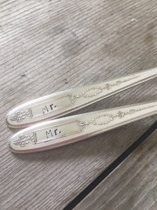 Closeup of the stamping in the box on the Grosvenor silverplate forks for a gay wedding