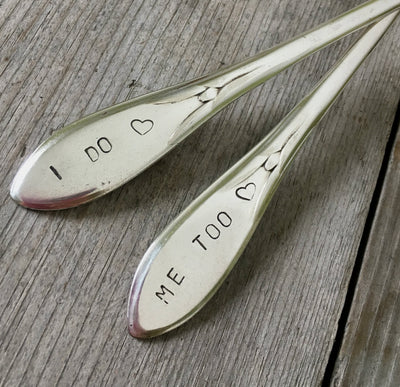 Close up of hand stamped I do Me Too on Vintage Pickwick Wedding cake forks