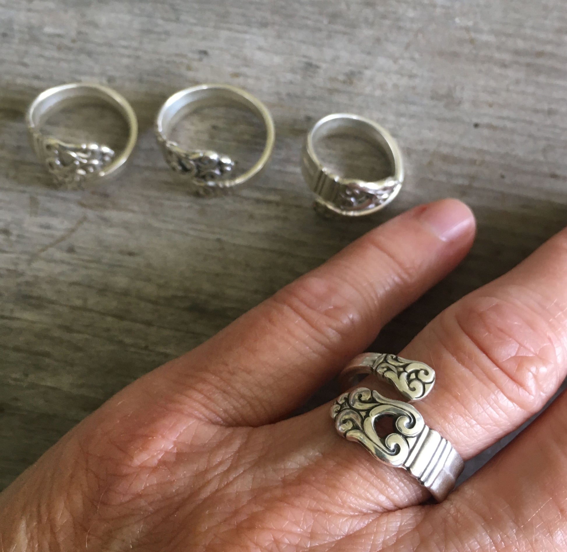 Coil-wrap sterling silver Royal Danish spoon ring on hand displaying adjustable fit and vintage 1939 pattern