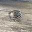 Josephine pattern sterling silver coil wrap spoon ring flatlay - Sterling spoon ring - handcrafted from upcycled vintage silverware - Laughing Frog Studio