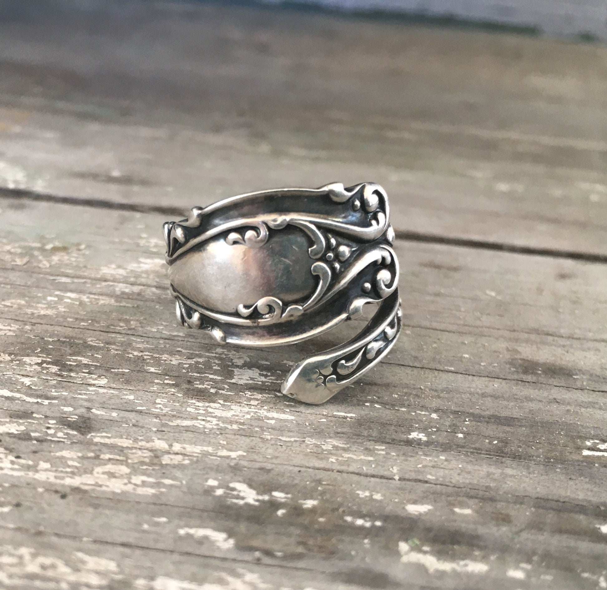 Josephine pattern sterling silver coil wrap spoon ring flatlay - Sterling spoon ring - handcrafted from upcycled vintage silverware - Laughing Frog Studio