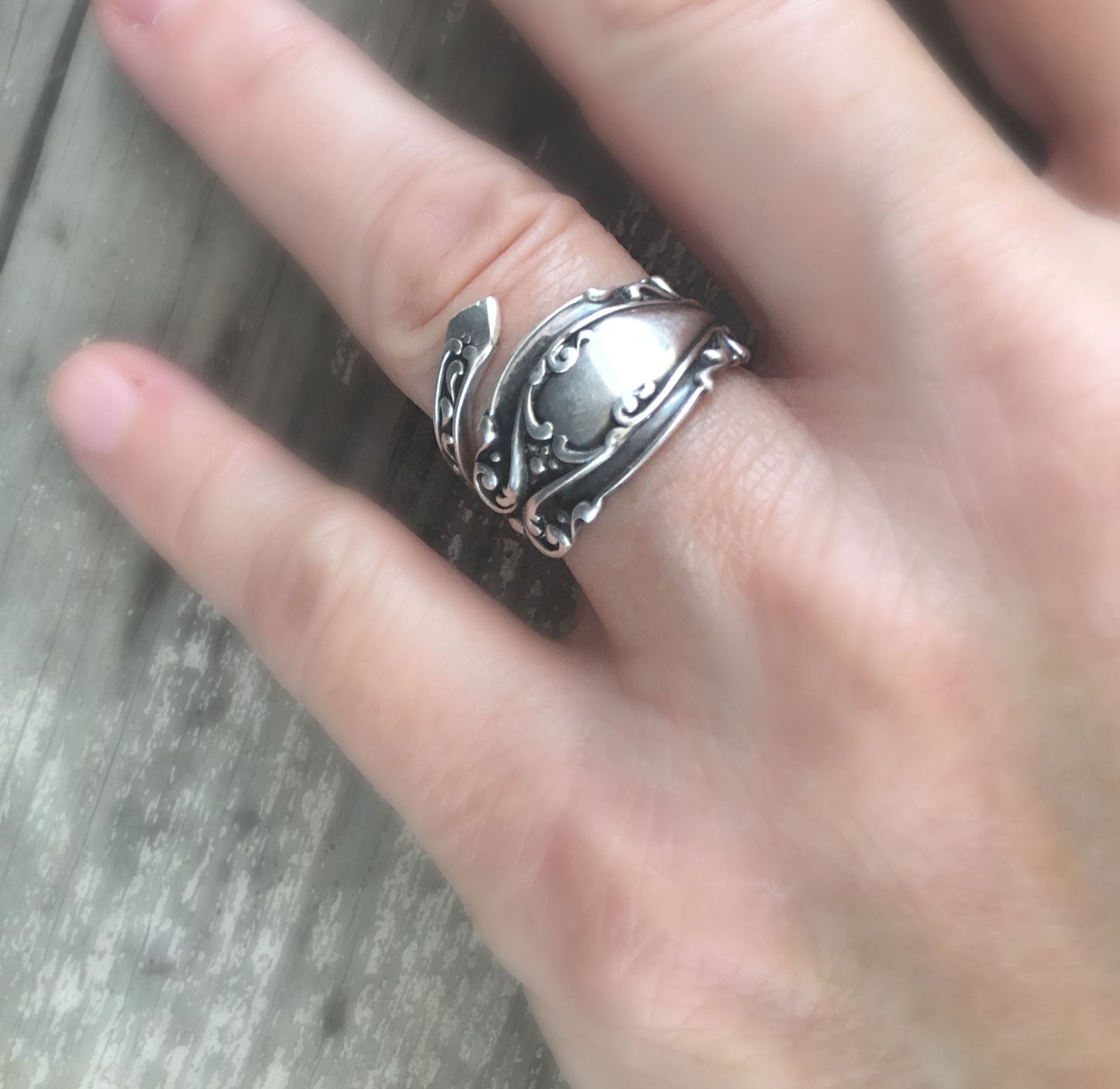 Josephine pattern sterling silver coil wrap spoon ring worn on model's hand - Sterling spoon ring - handcrafted from upcycled vintage silverware - Laughing Frog Studio