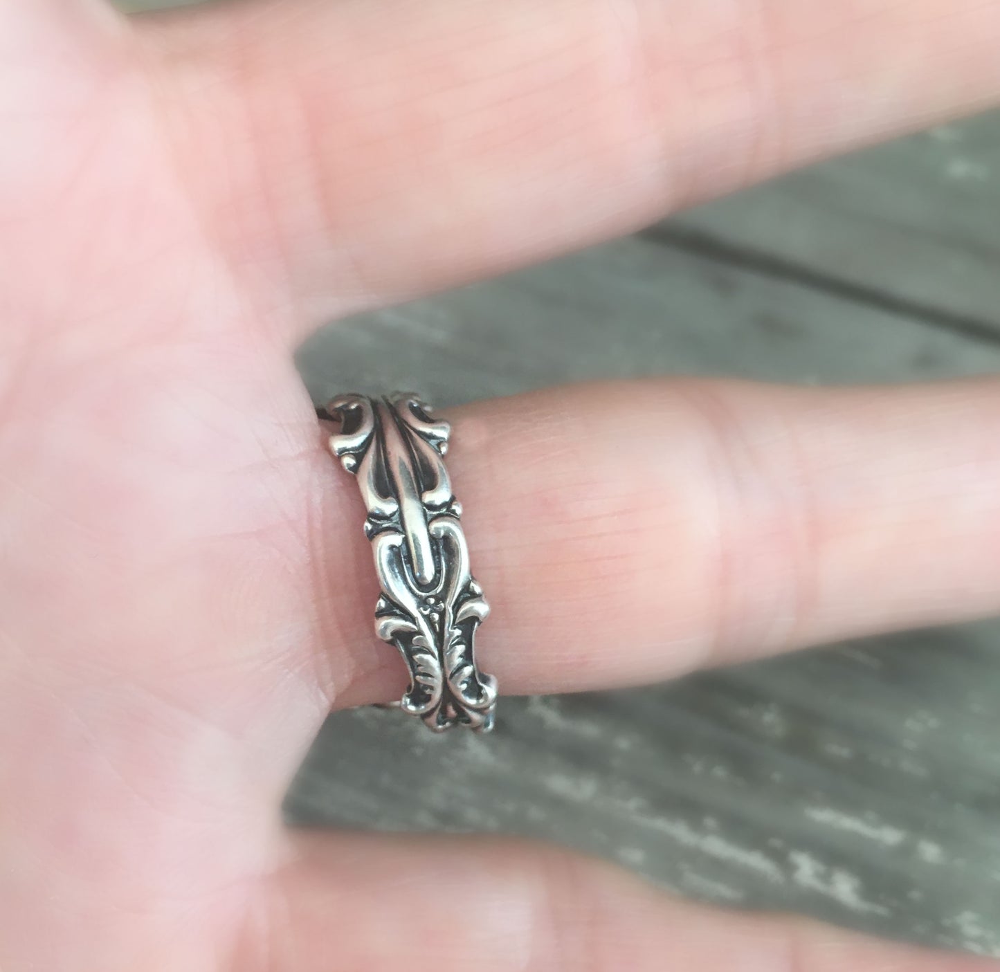 Underside of Josephine pattern sterling silver coil wrap spoon ring on model - Sterling spoon ring - handcrafted from upcycled vintage silverware - Laughing Frog Studio