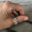 Kirk & Son Repoussé sterling silver spoon ring on hand displaying wearable fit and ornate floral pattern
