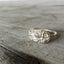 Sterling silver Kirk & Son Repoussé spoon ring with deeply embossed continuous floral pattern from 1828 design