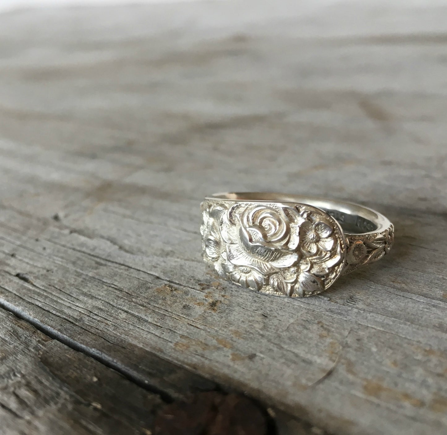 Sterling silver Kirk & Son Repoussé spoon ring with deeply embossed continuous floral pattern from 1828 design
