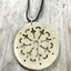 Close up of Tomato Server Necklace Silverplate Silverware Jewelry Hanging from Black Leather Cord from Fairfield Plate