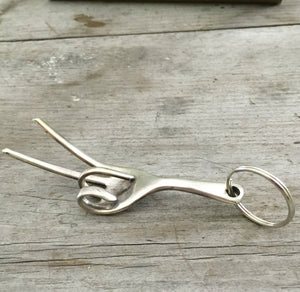 Side View of Fork Keychain bent to look like the hand gesture for the symbol of peace
