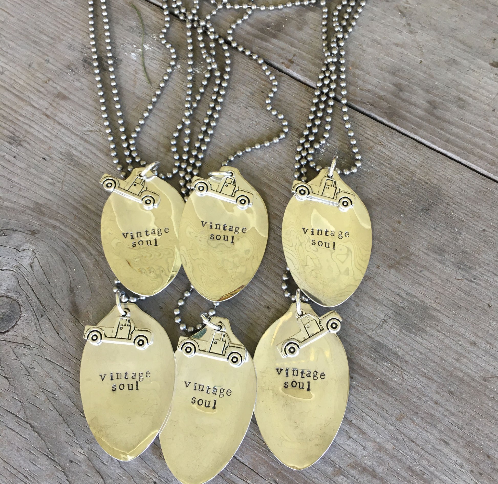 Multiple VINTAGE SOUL hand-stamped spoon necklaces showing vintage pickup truck charm detail and reclaimed silverware design
