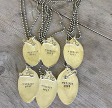 Another view of a bunch of Hand Stamped Spoon Necklace that reads Vintage Soul and is adorned with a pickup truck charm