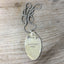Close-up of VINTAGE SOUL stamped spoon necklace with vintage truck charm on ball chain, one-of-a-kind upcycled silverplate