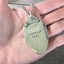 VINTAGE SOUL hand-stamped spoon necklace with vintage truck charm held in hand for scale unique vintage font