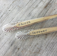 Closeup of hand stamping on Radiance Wedding Cake forks
