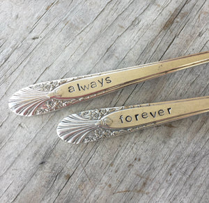 Closeup of hand stamping on Radiance Wedding Cake forks