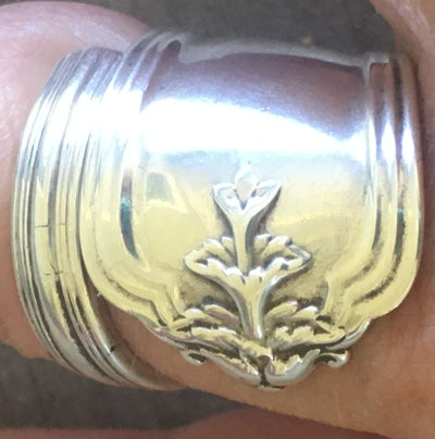 Close-up of tiered botanical plant motif on Duchess pattern sterling silver upcycled demitasse spoon ring