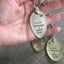 Close-up of WINE WEEKENDS & LAKE DAYS hand-stamped spoon pendant with wine glass charm showing reclaimed vintage silverware, summer-inspired design
