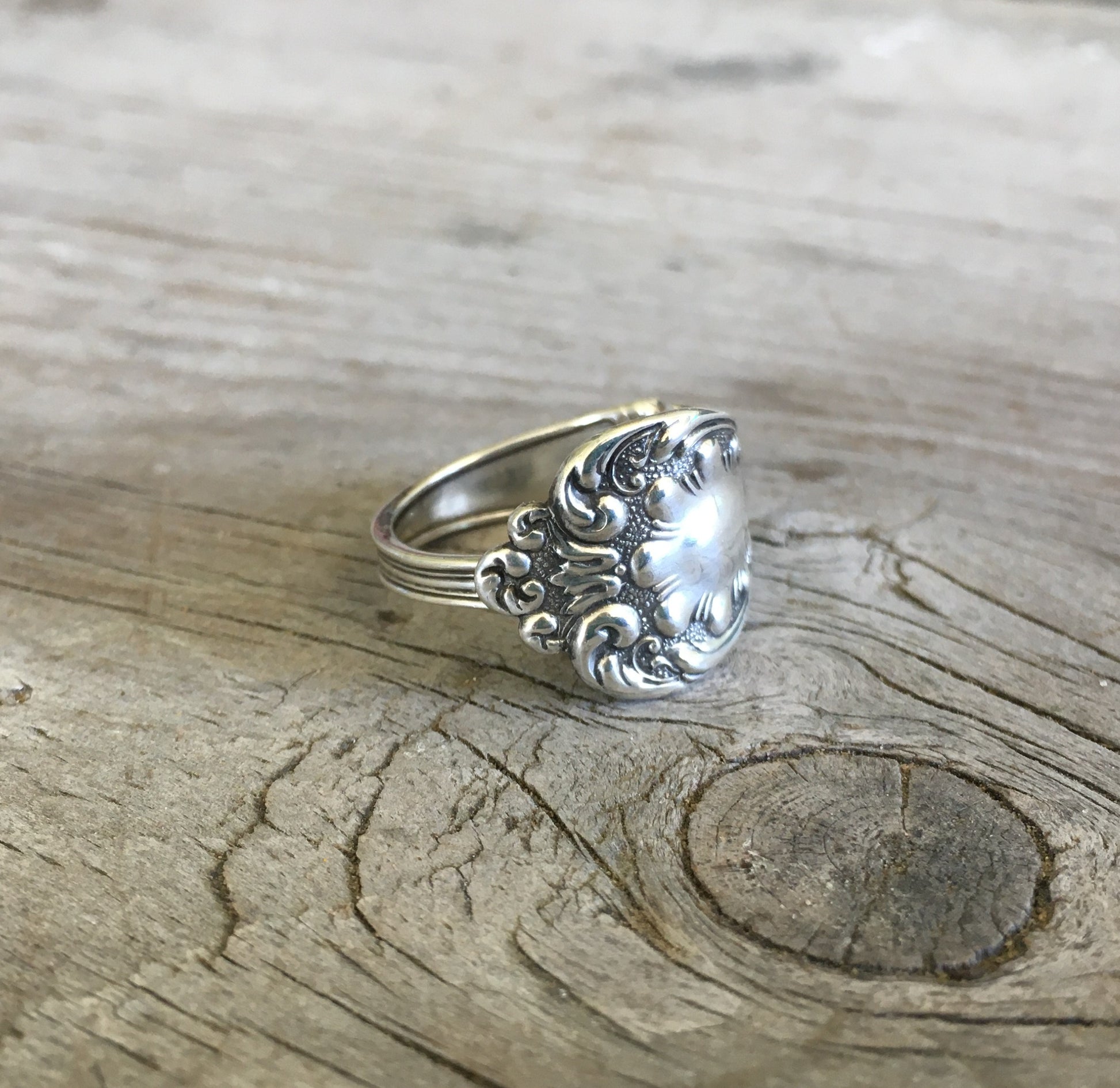 Close-up of intricate paisley and curly-q flourishes on sterling silver spoon ring - Sterling spoon ring - handcrafted from upcycled vintage silverware - Laughing Frog Studio