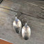 Close-up of Keys To The Castle hand-stamped lettering on vintage spoon keychain upcycled silverware
