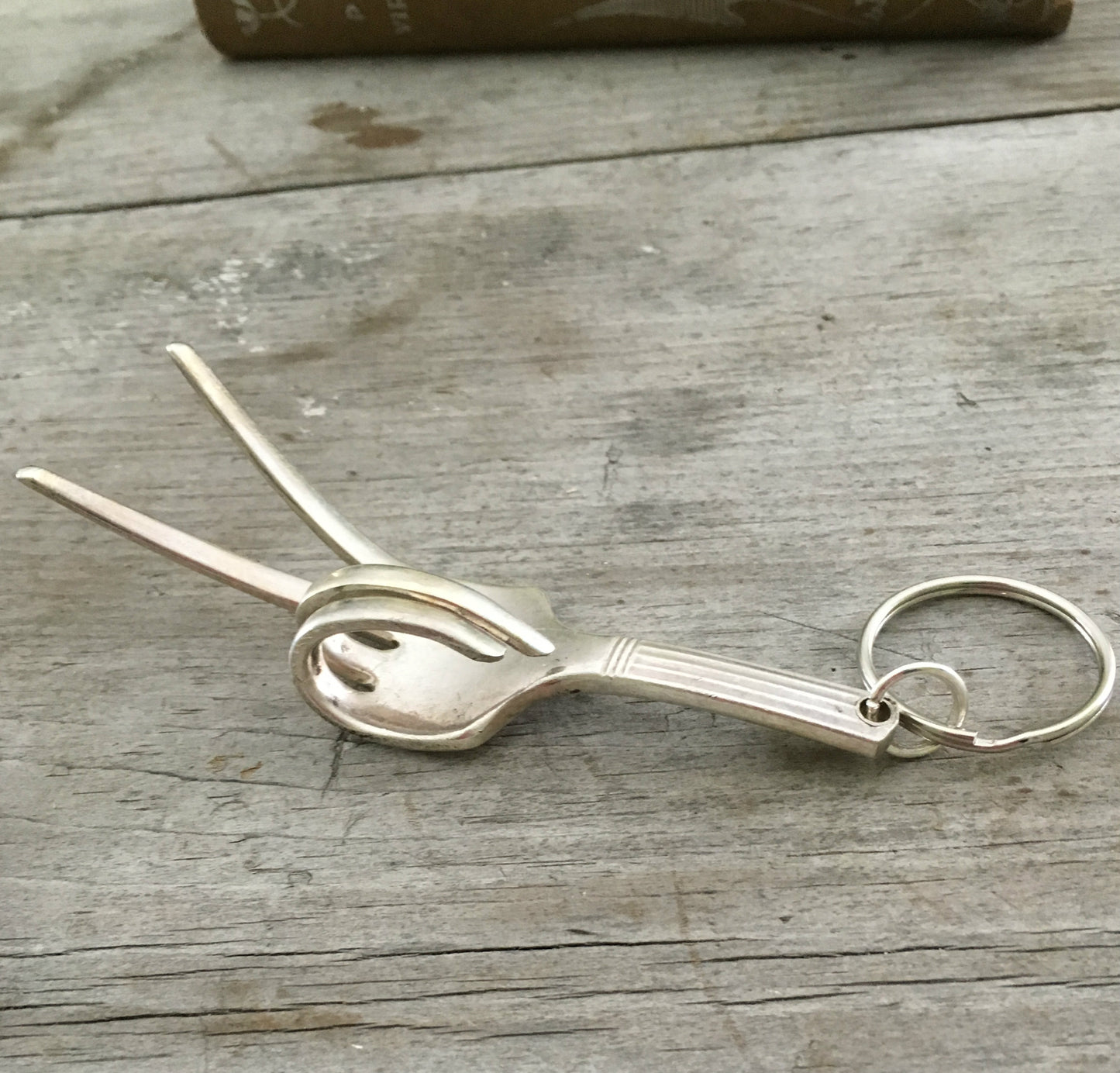 Fork Keychain bent to look like the hand gesture for the symbol of peace