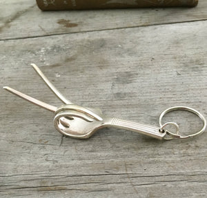 Fork Keychain bent to look like the hand gesture for the symbol of peace