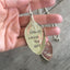 Close-up of FRIENDS ANCHOR THE SOUL hand-stamped spoon pendant with pewter anchor charm showing reclaimed vintage silverware, sentimental design