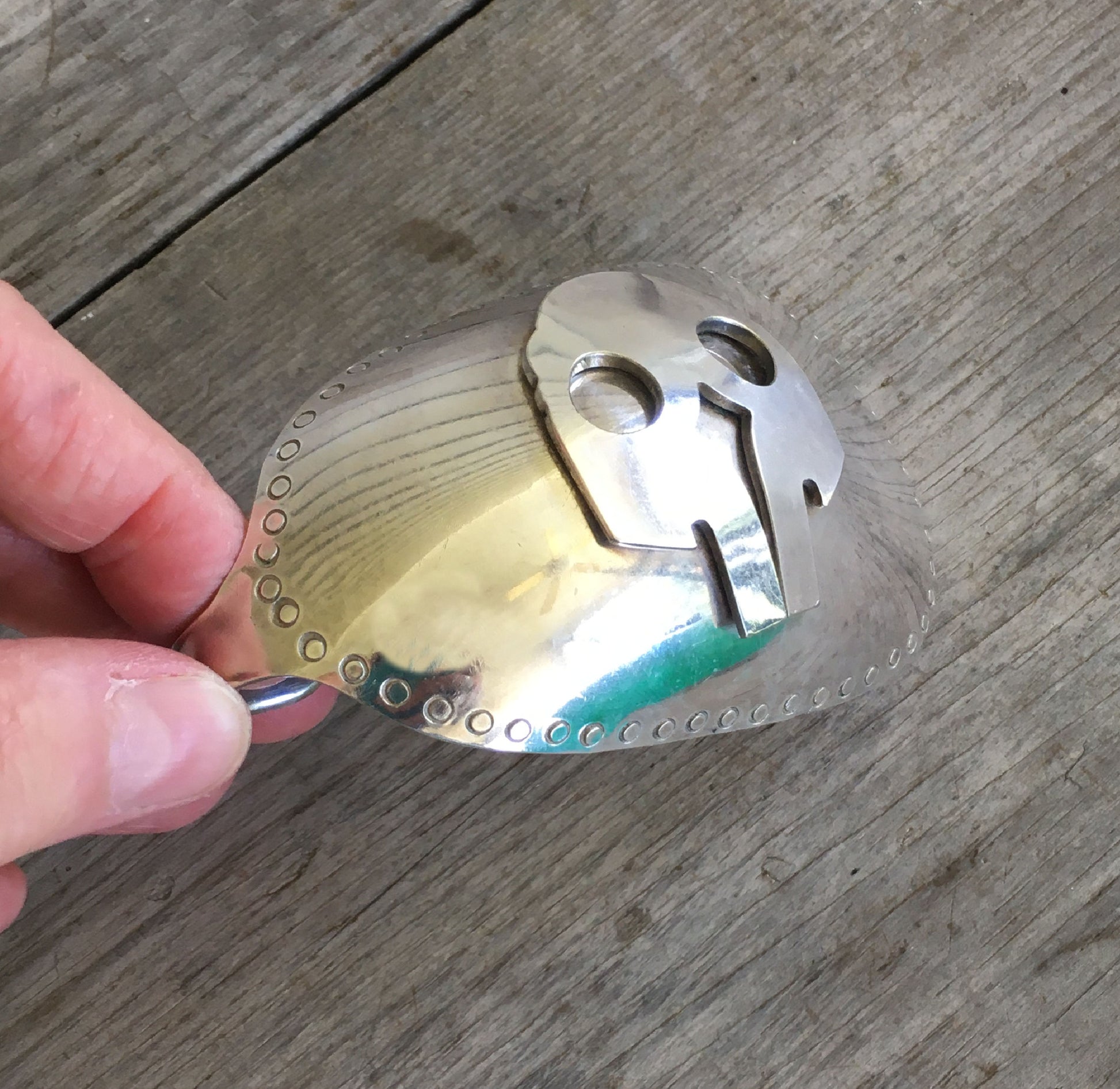 Spoon belt buckle with applied fork skull detail