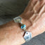 Upcycled silverware bracelet shown on model