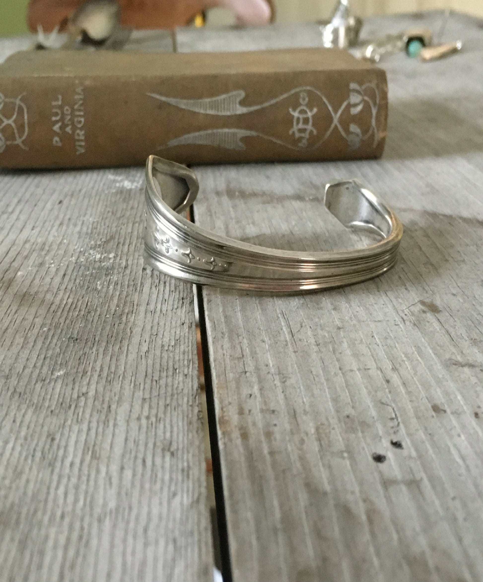 Silverware cuff bracelet made from serving spoon stamped peace