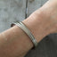 Peace Spoon Cuff bracelet shown on model's arm